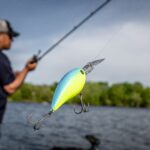 man catching fish with Shimano fishing gear