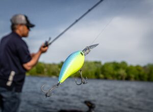 man catching fish with Shimano fishing gear
